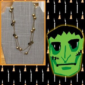 Gold and clear black beaded gold tone necklace